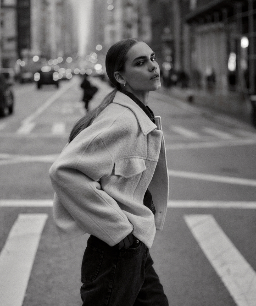 Woman wearing wool jacket.